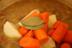 Simmer ingredients for goat meat stew recipe