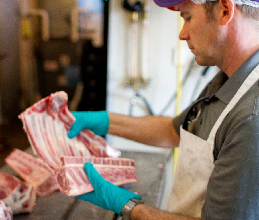 Chef Jason Gibbons evaluating lamb rack