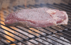 Goat leg steak on grill