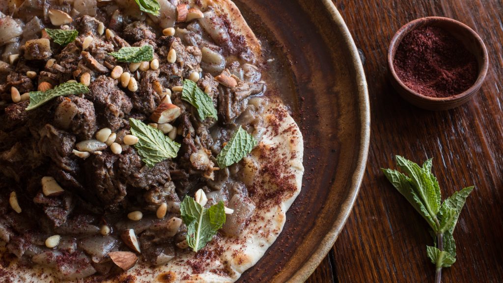 Lamb or goat mousakahn with sumac and onions