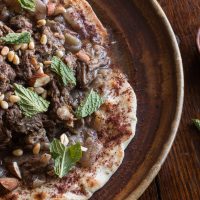 Lamb or goat mousakahn with sumac and onions