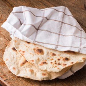 Lamb or goat mousakahn with sumac and onions