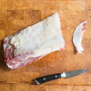 Trimming a goat rack for roasting
