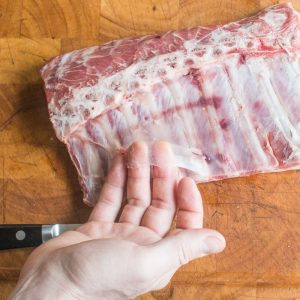Trimming a goat rack for roasting