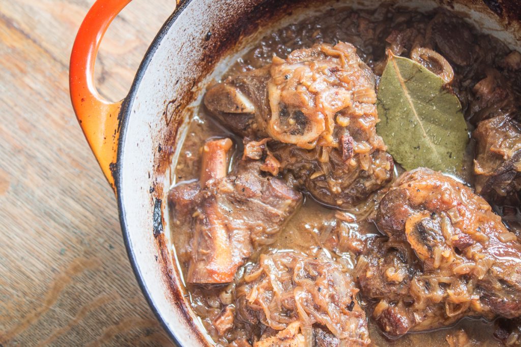 Grass fed lamb or goat shanks braised with onions