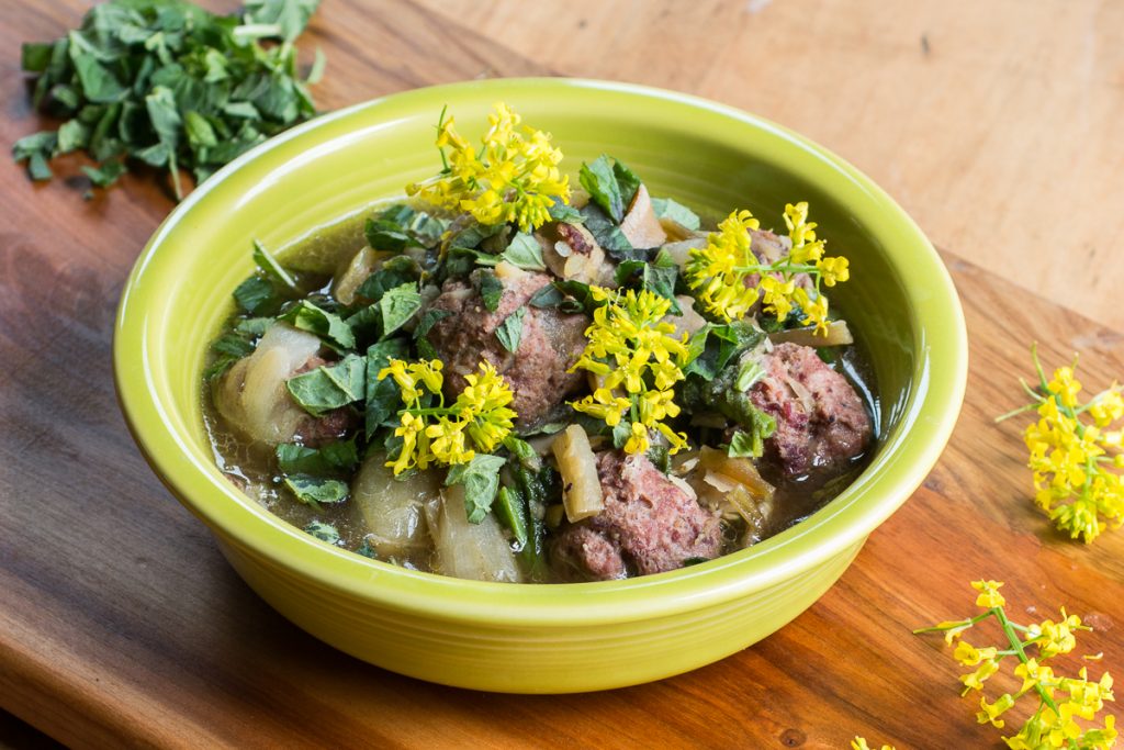 Grassfed lamb or goat meatball stew recipe with greens and fava beans 