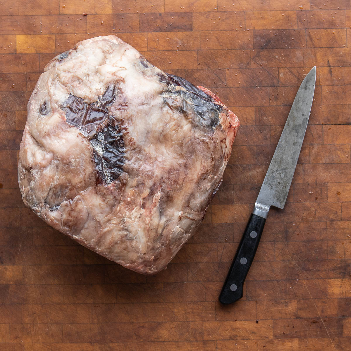 a 30 day dry-aged mutton leg ready for trimming.