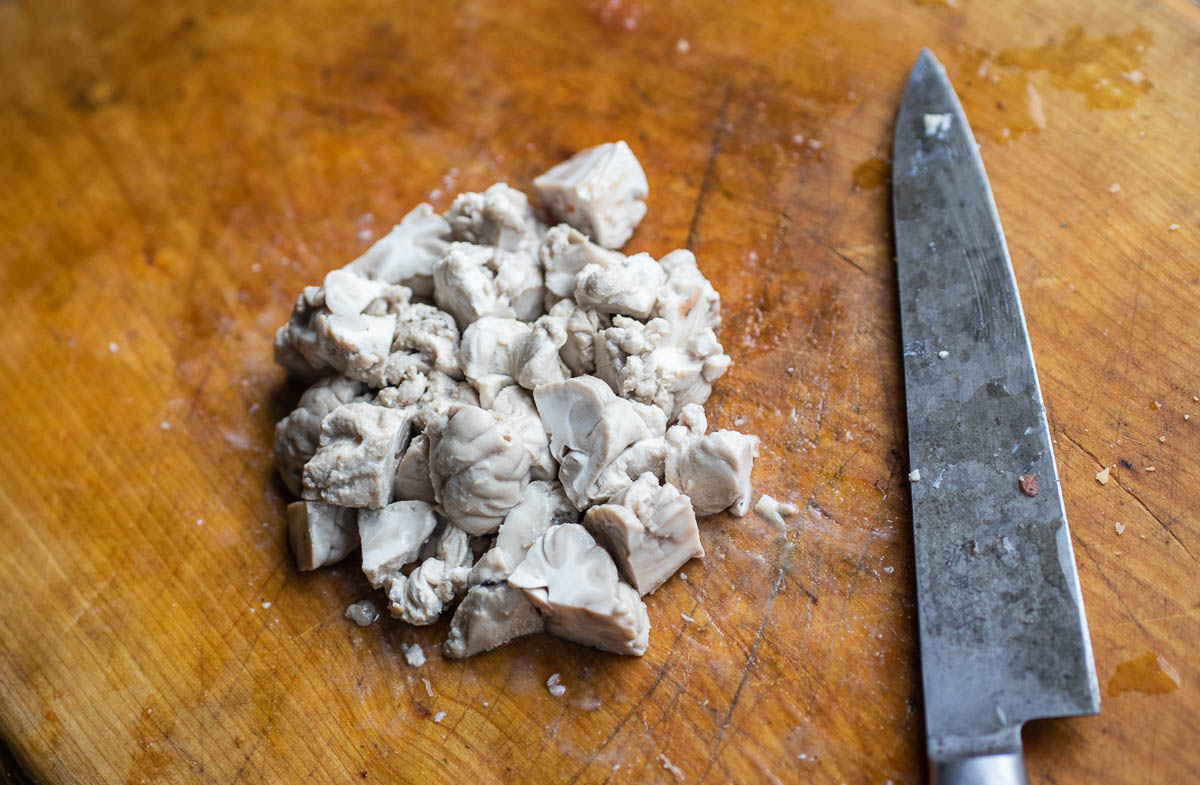 Cutting cooked lamb brains