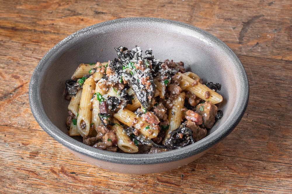 Lamb ragu with black trumpet mushrooms and penne