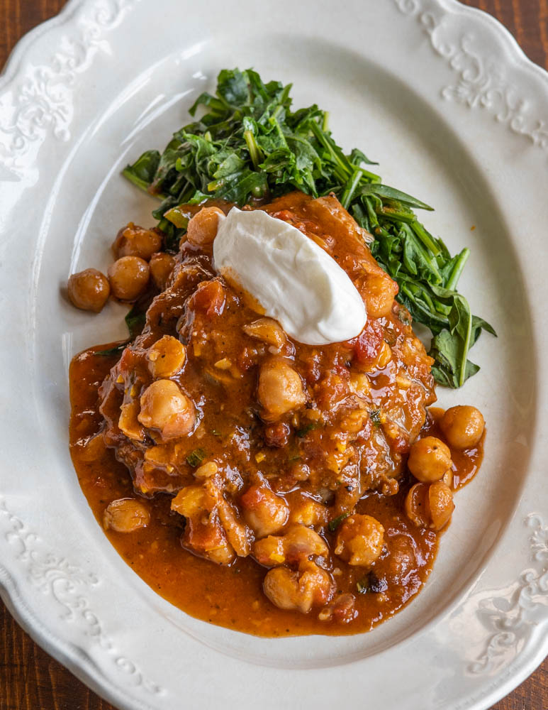 Braised goat neck with tomato, chickpeas and harissa Moroccan recipe