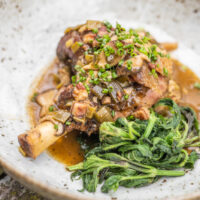 Goat shanks with pheasant back mushrooms and nettles