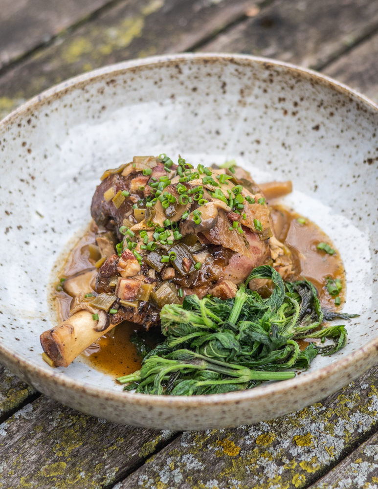 Goat shanks with pheasant back mushrooms and nettles