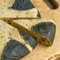 Lamb crackling cornbread wrapped in wild leaves