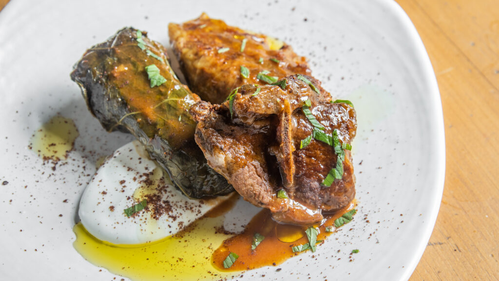 Iraqi dolma with lamb chops, yogurt, mint, and sumac