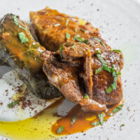 Iraqi dolma with lamb chops, yogurt, mint, and sumac