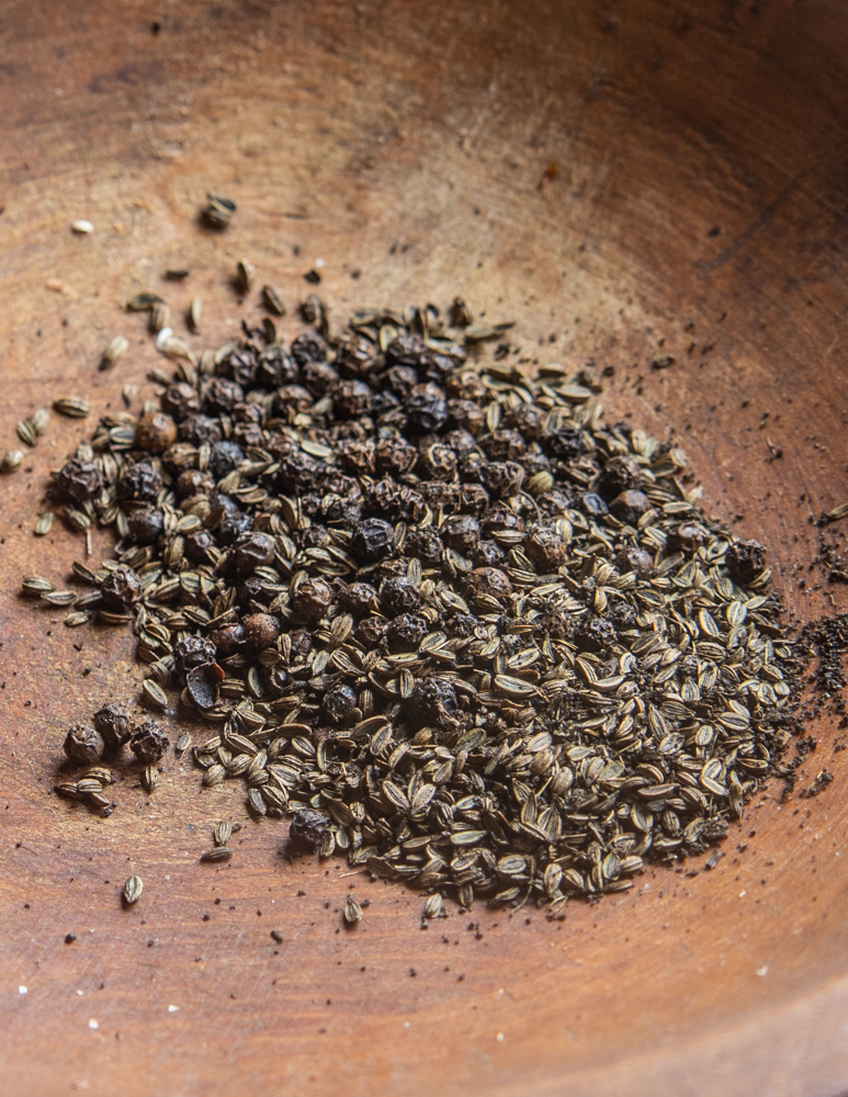 Grinding toasted black pepper and wild fennel seeds for Italian Sausage