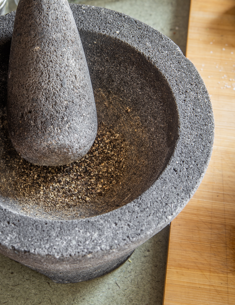 Crushing black peppercorns