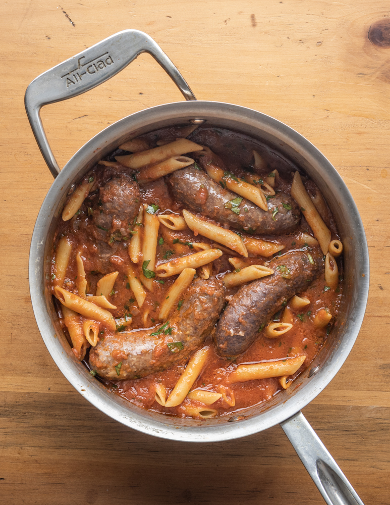 Slow cooked lamb or goat Italian sausages with pasta