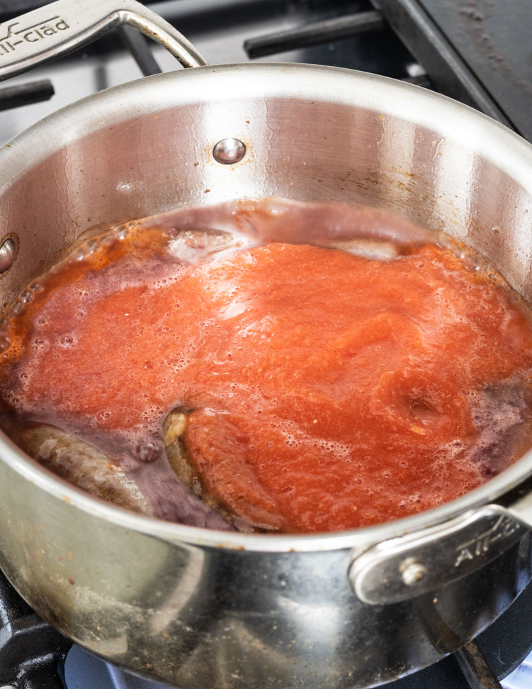 Slow cooked lamb or goat Italian sausages with pasta