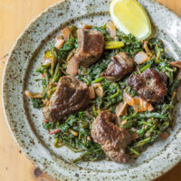 Goat Tsigarelli with purslane, watercress, and amaranth