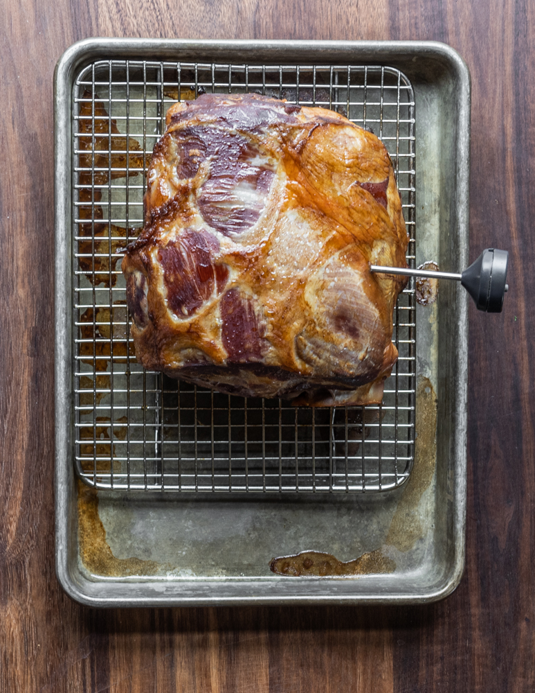 Smoked, brined leg of lamb on a sheet tray