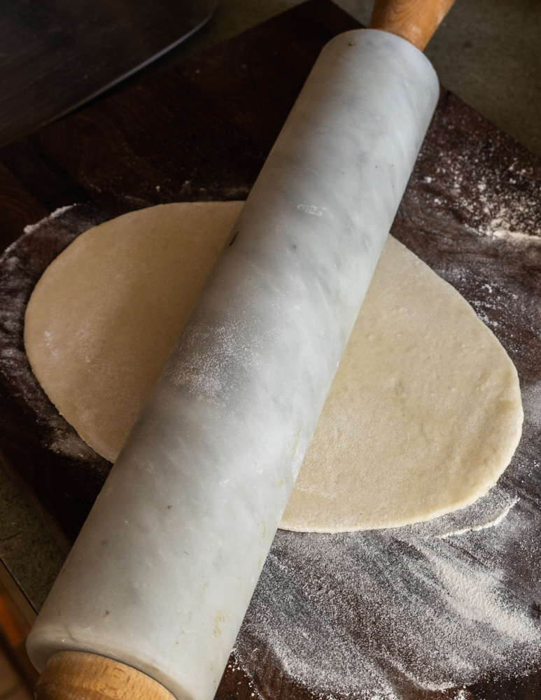 rolling out calzone dough